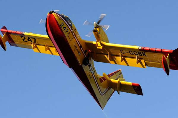 Canadian multi-purpose aircraft, CL - 415, flies in clear skies