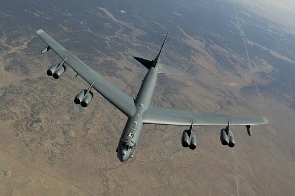 Flight of a strategic bomber over the desert