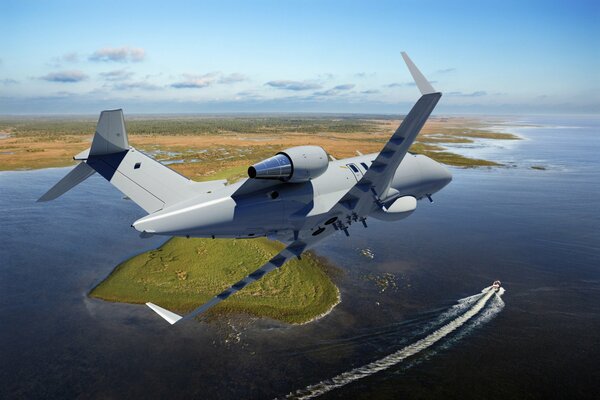 Business jet Bombardier Challenger 600 against a background of green landscape and water.