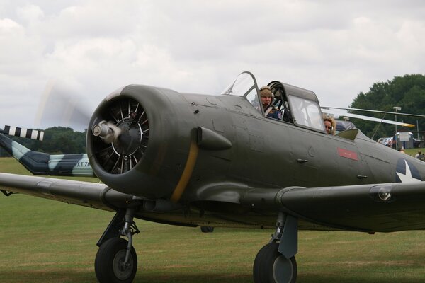 The American t-6 Texan aircraft is running with the engine running