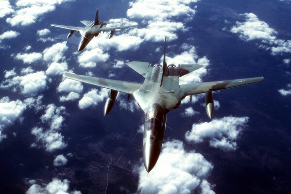 A pair of tactical bombers went flying among the white clouds