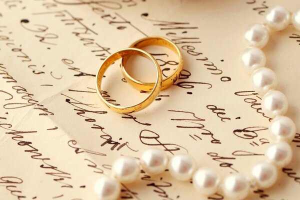 A letter with a beautiful handwriting rings and pearls