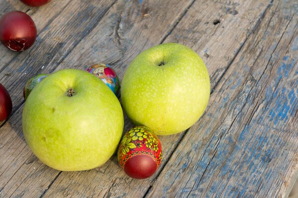 Easter eggs on the background of apples