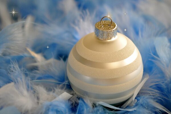 New Year s theme white ball on blue feathers