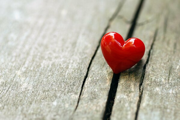 Background of a heart pendant on a wooden bench