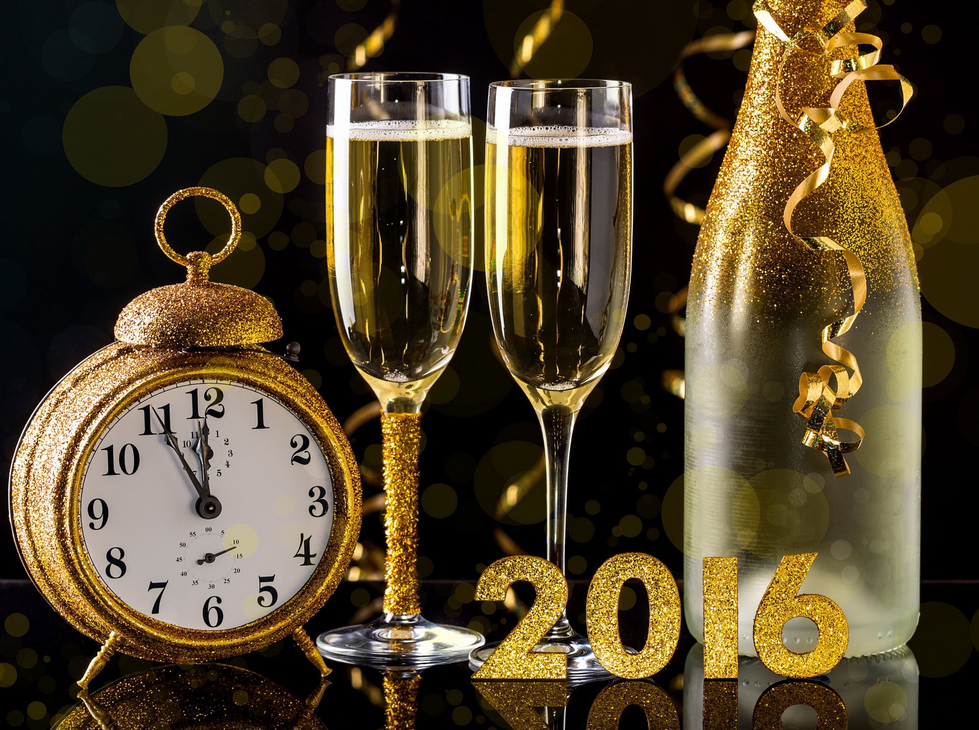 2016 happy new year golden champagne a bottle glasses watche