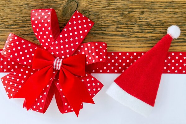 Christmas decorations: Red Christmas bow and Santa hat