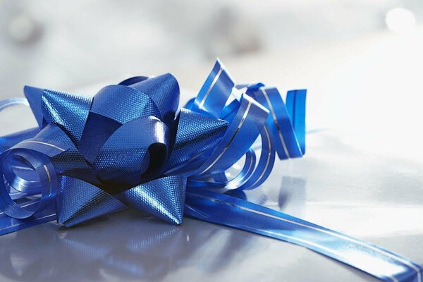 Gift. Blue ribbon with bow