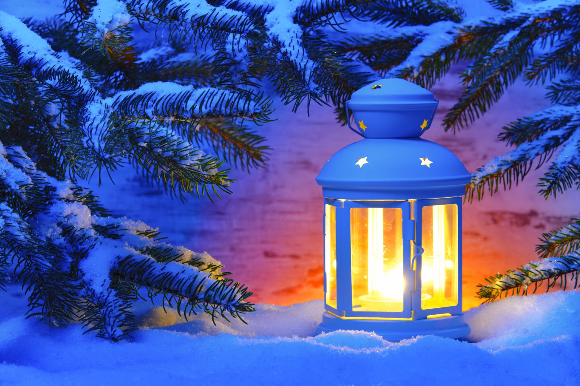 evening lantern snow spruce branches light