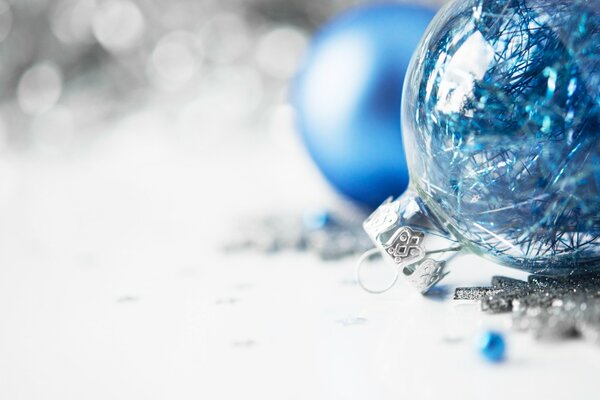 Blue glass toys on a blurry background