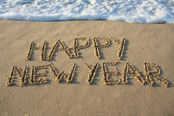 Buon Anno Nuovo. Congratulazioni in riva al mare