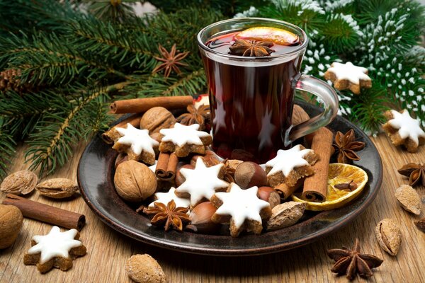 Christmas attributes. Pine needles, mulled wine, cookies