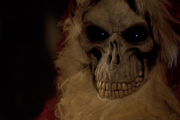 A skeleton in a Santa Claus costume