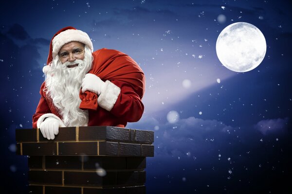 Santa Claus with a bag of gifts to the full moon