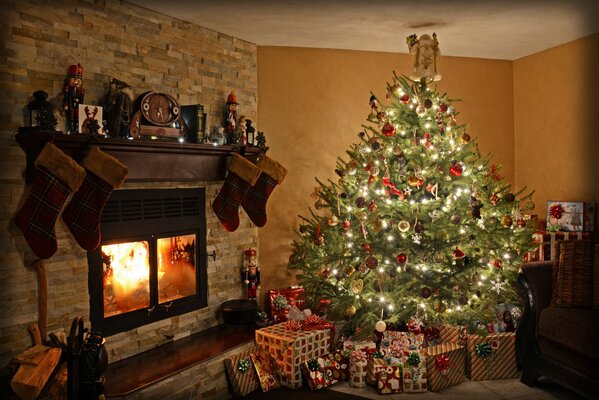 Christmas evening with gifts by the fireplace