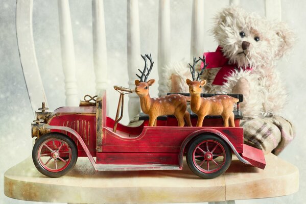 A teddy bear is sitting on a chair in the car