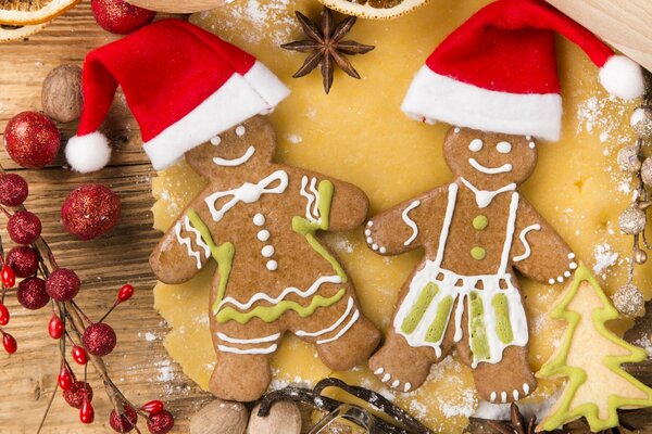 Cookies in the form of little men in Santa Claus caps