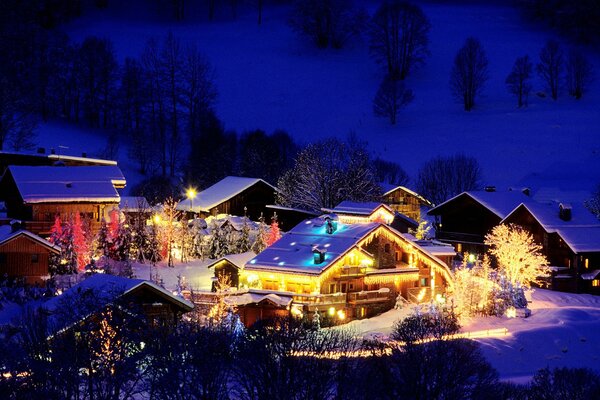 A village in the twinkle of Christmas lights