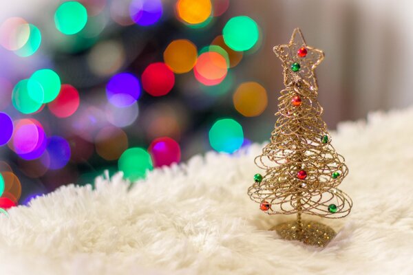 Cute golden toy under the Christmas tree