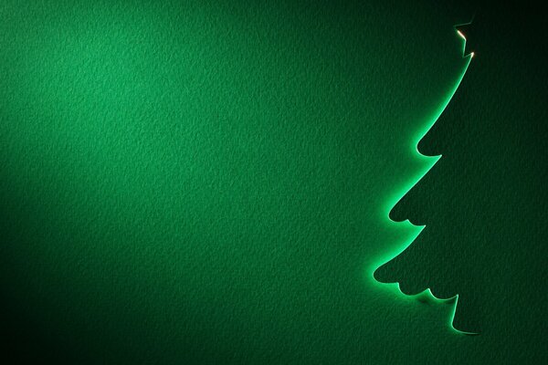 Silhouette of a Christmas tree on a green background