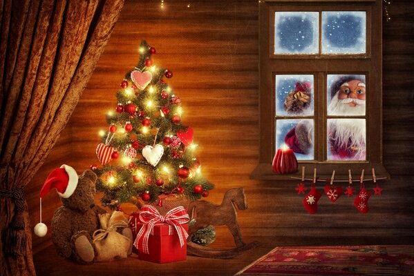 Santa Claus dejó regalos bajo el árbol de Navidad a los niños en la casa