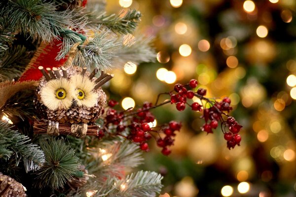 Christmas tree toys on a branch with an owl