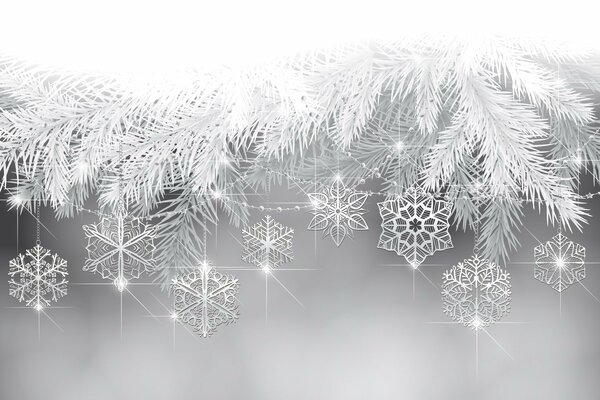 Snowflakes of different shapes hang from the branches