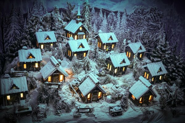 Case invernali nella neve con finestre