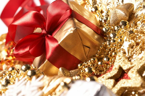 Gold-plated box with a red bow