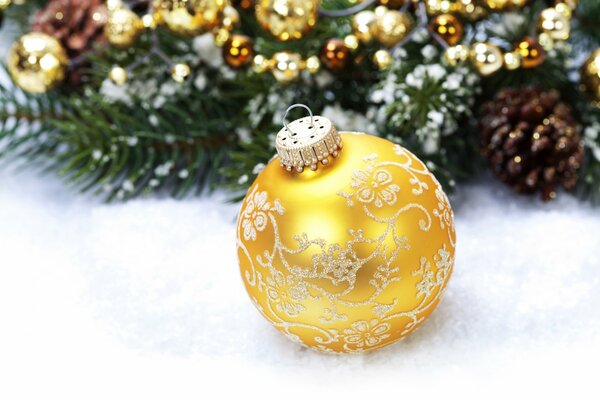 Christmas decoration - a golden ball on the Christmas tree