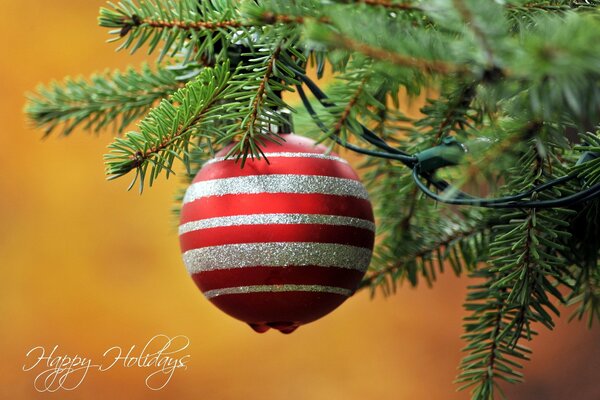 Christmas toy hanging on the branches of a fir tree