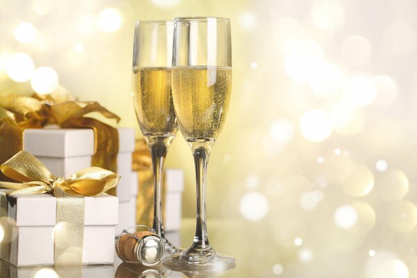 Sparkling wine in glasses, Christmas gifts