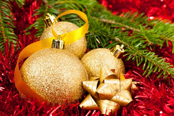 Golden Christmas balls and red tinsel