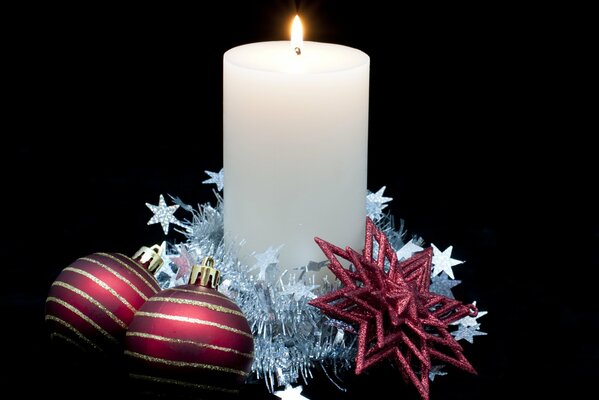 Christmas candle on a black background