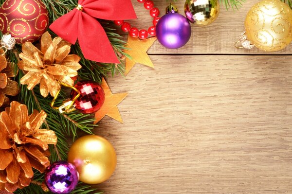 Christmas toys on a branch of a fir tree