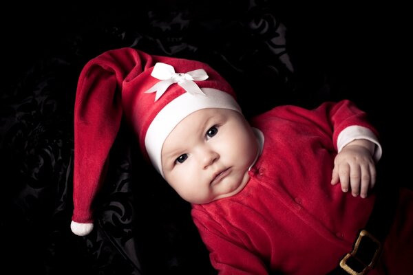 A child in a festive Santa costume