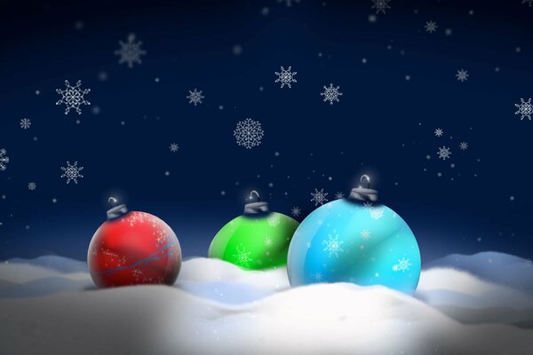 Three colorful Christmas balls in the snow