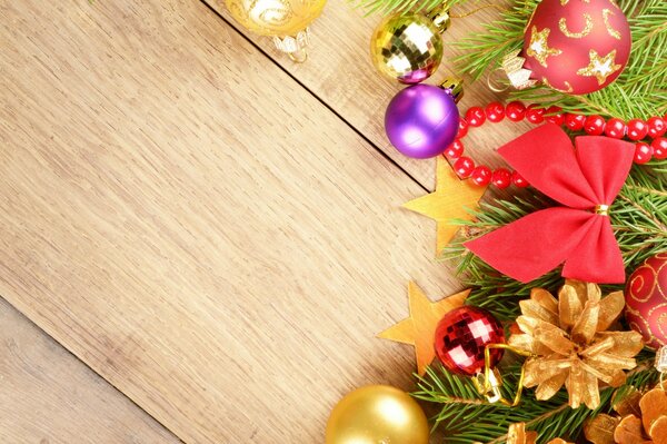 Christmas toys on a branch of a fir tree