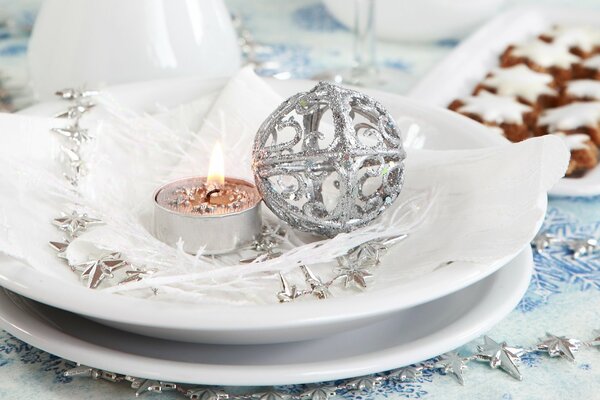 Christmas Candle and ball in a plate