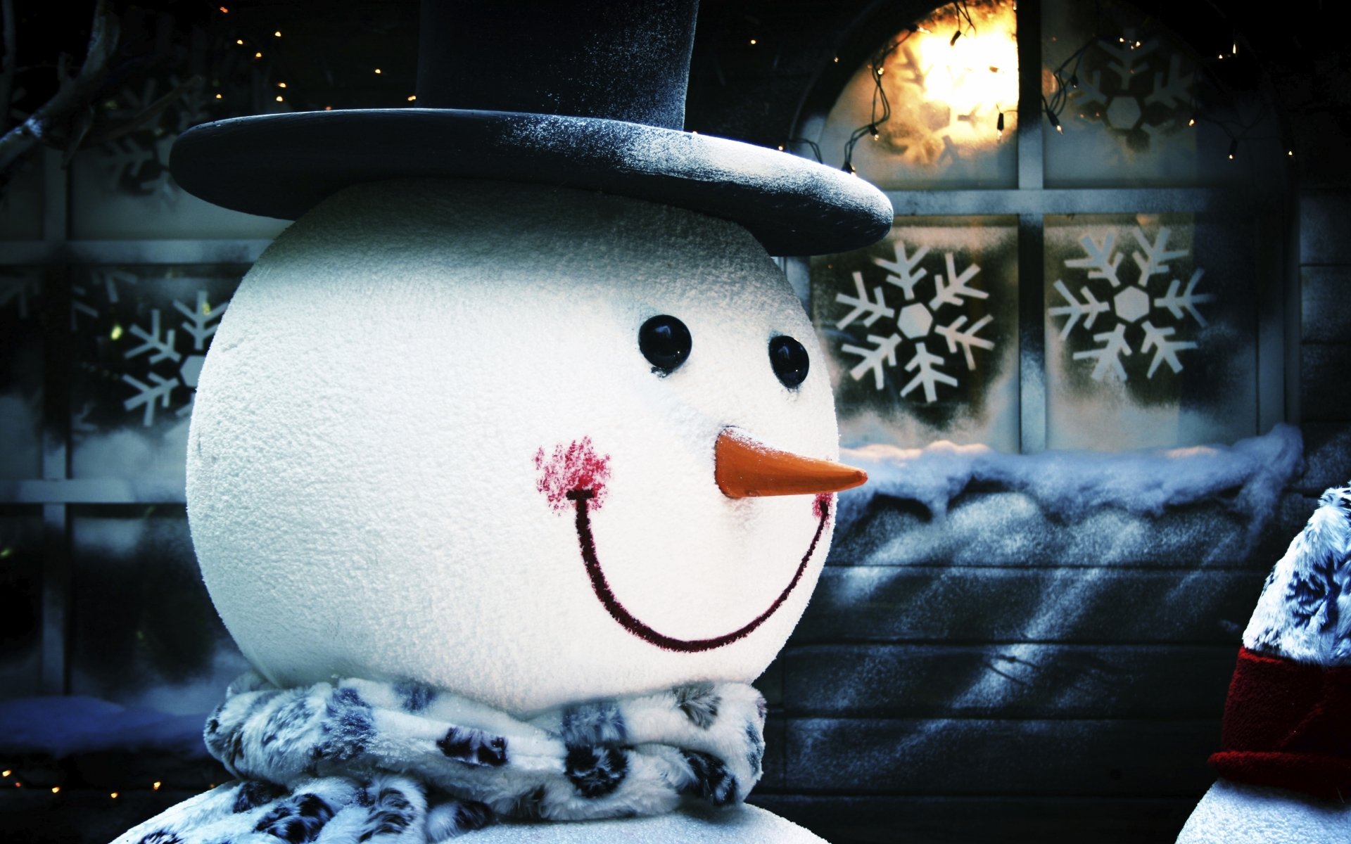 new year snowman in a scarf in the cap snowflakes christmas background nose-carrot