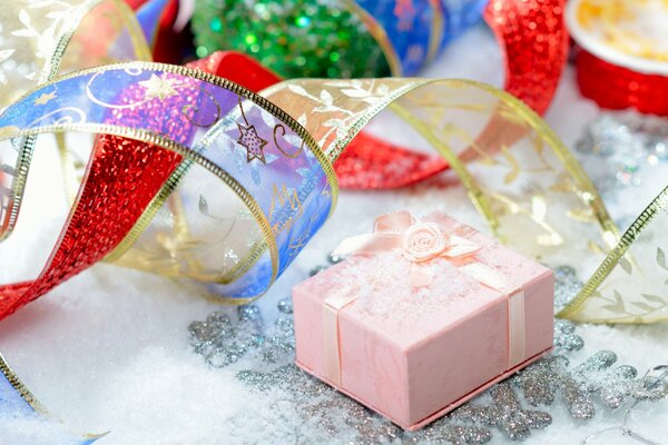 Packaging of gifts for the new year with ribbons, bows, sequins