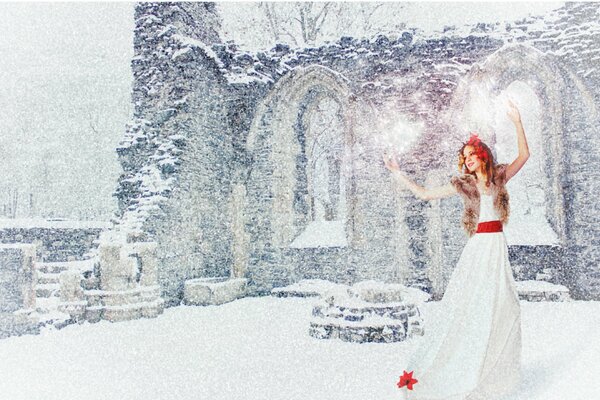 A girl in a white dress with a red belt dances in the new year