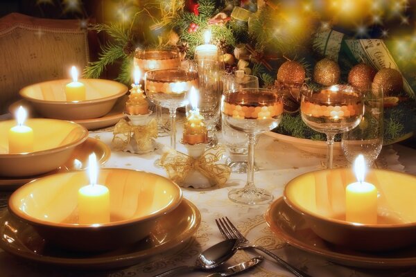 Serving New Year s table with glasses and candles