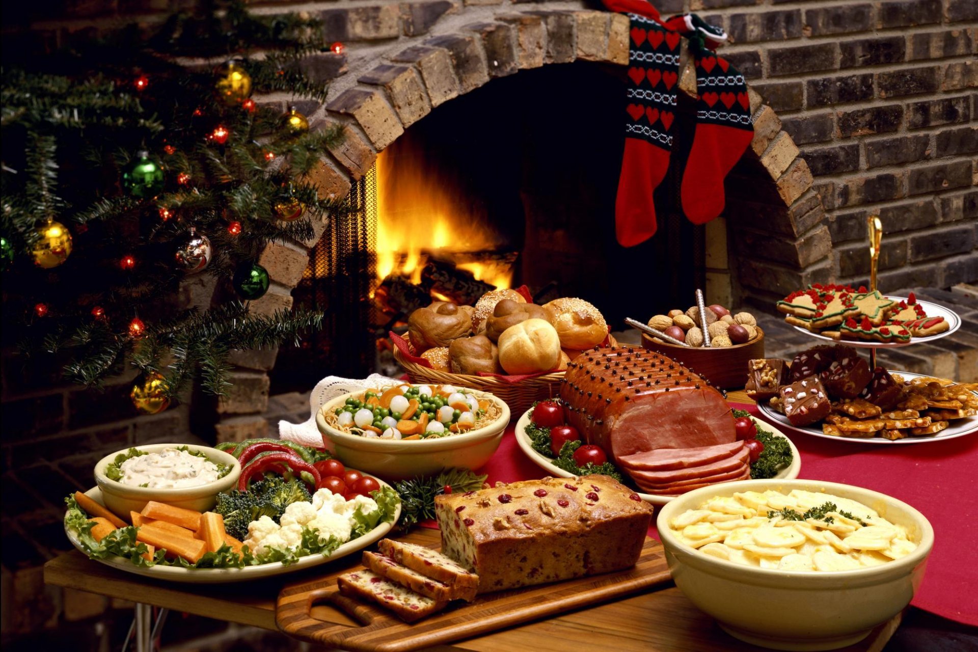 new year celebratory table food dishes meat fireplace christmas tree sock