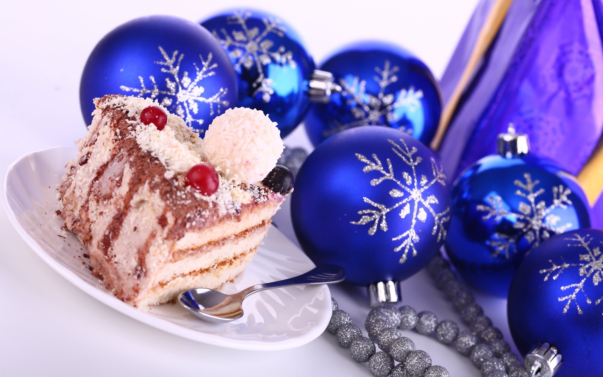 holiday new year silver beads blue snowflakes cake cake delicious dessert berries coconut chips spoon