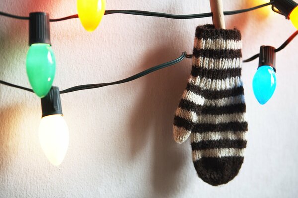 Striped mittens hanging on a garland