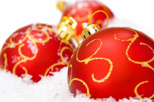 Red Christmas balls in the snow