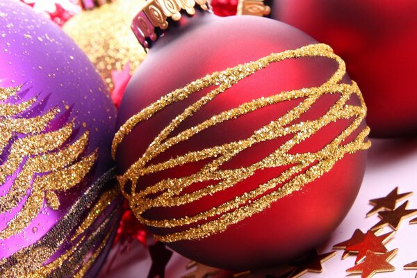 Red Christmas ball with gold stripes