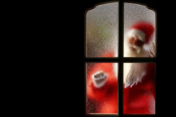 Santa Claus behind the glass