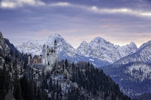 White castle on the background of the Bavarian mountains